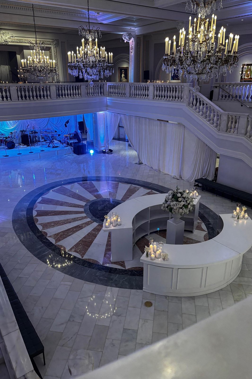 Elegant ballroom with crystal chandeliers styled for an event by Meraki Occasions